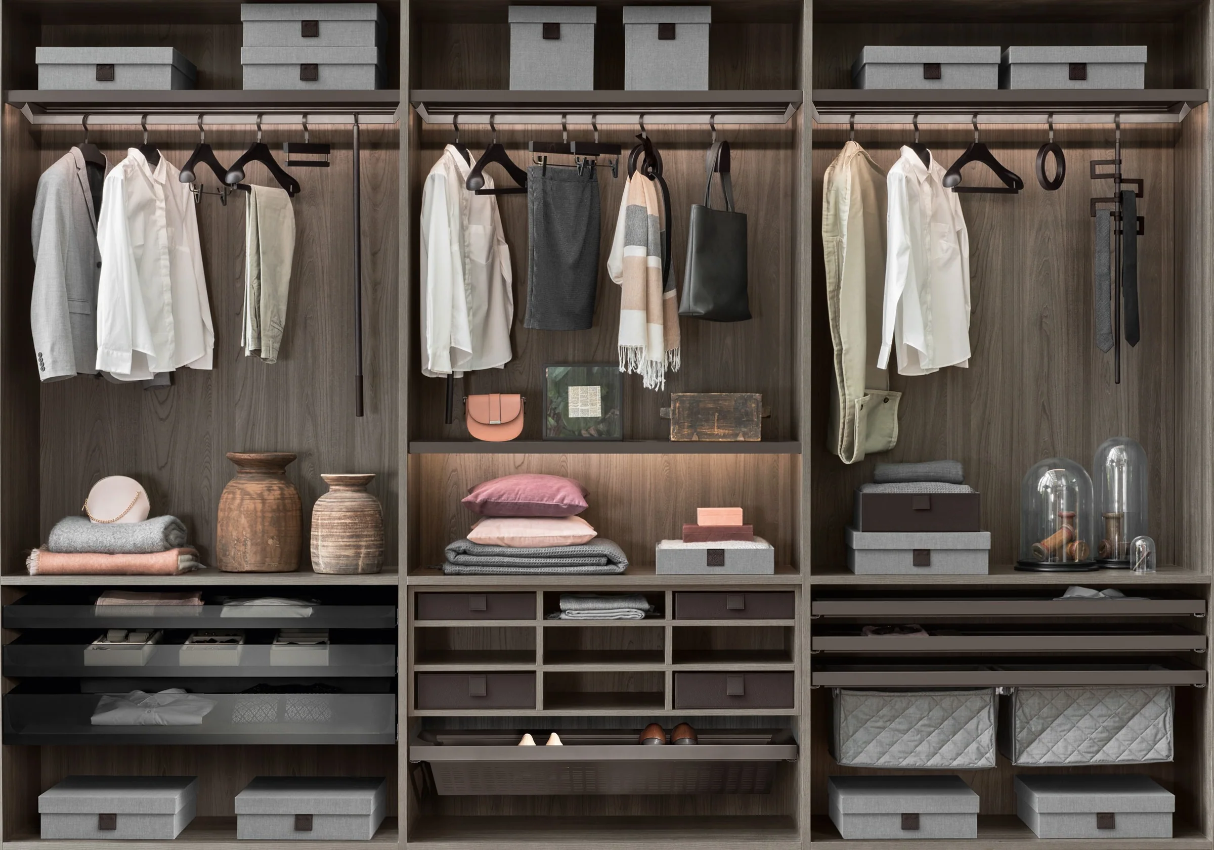 A CAELEN walk-in wardrobe, softly lit